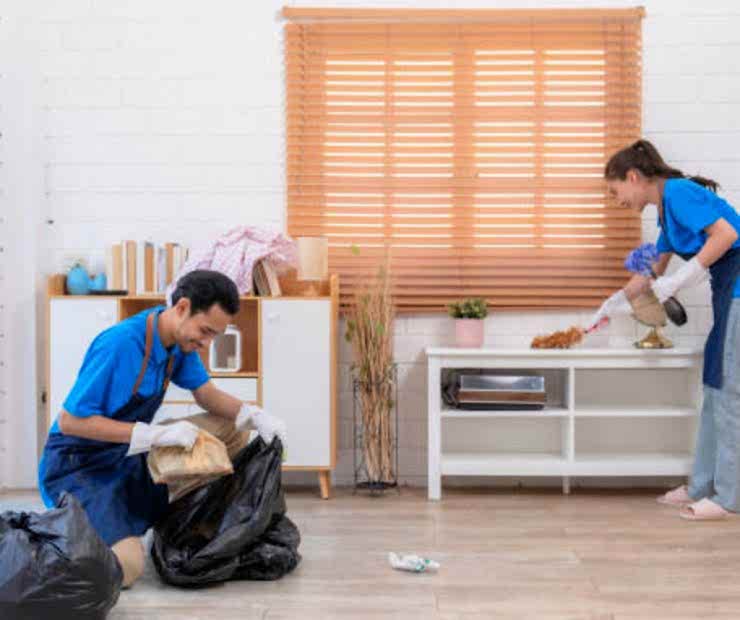 Male and female staff cleaning customers’ homes.